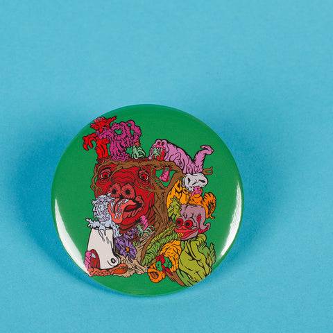 Green Peculiar Path Art Pin Button By Danica Daydreams On A Blue Background